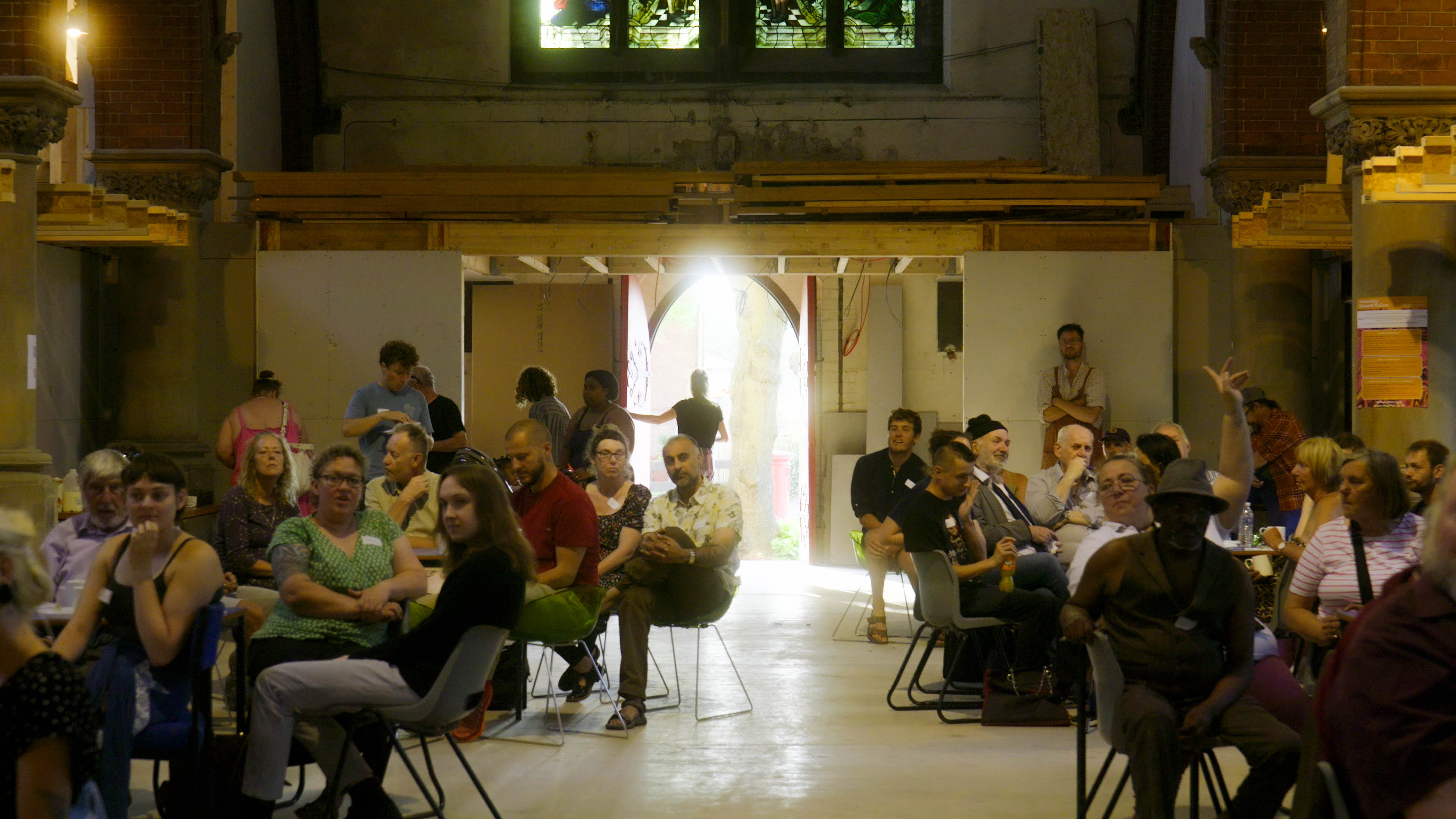 A room full of people taking part in an People's Assembly